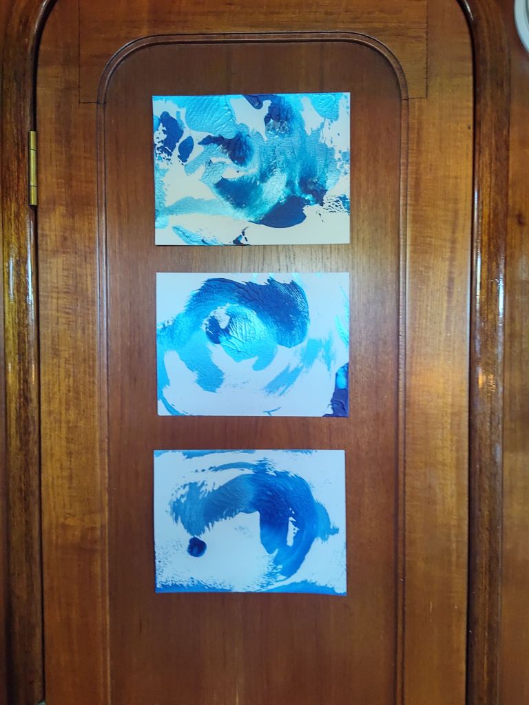 "Make a Splash Triptych" by Shé, 8" x 20.5" acrylic on paper on teak, 2024